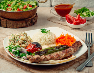 Wall Mural - lule kebab with rice and vegetables