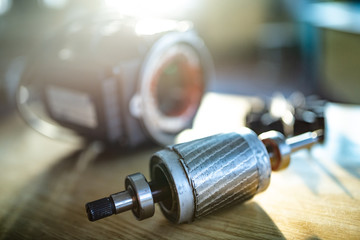 Wall Mural - Close-up of a disassembled metal motor with wire