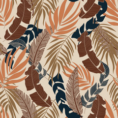  Abstract seamless tropical pattern with bright orange and blue plants and leaves on beige background. Printing and textiles.  Exotic tropics. Summer. Tropic leaves in bright colors.