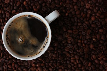 Coffee beans and coffee Americano on the table