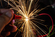 Bright burning sparks fly from the electric short contact