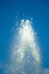 Blue water drops on blue sky background