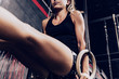 © Aparicio Febrer/ADDICTIVE STOCK - Focused shapely woman performing pull-ups on gymnastic rings in sport club