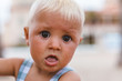 © Marcos Osorio/ADDICTIVE STOCK - Portrait of a blonde baby boy on the beach