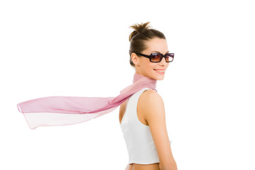 A beautiful girl with glasses and a light scarf flying in the wind