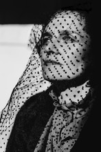 Portrait Of A Woman With A Black Dotted Veil