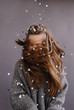 © Liliya Rodnikova/Stocksy - Unrecognizable woman with long swirling hair under the rain of confetti