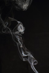 Abstract white smoke texture on black background