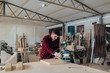 © Brat Co./Stocksy - Carpenter in Workshop