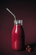 © Vera Lair/Stocksy - Red smoothie, currants and metal straw
