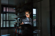 © Garage Island Crew/Stocksy - Young businesswoman using a tablet in her modern home studio office