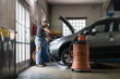 © Garage Island Crew/Stocksy - Mechanic at work in a repair car shop