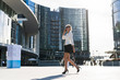 © Garage Island Crew/Stocksy - Happy businesswoman walking in the city