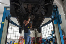 Mechanic At Work In A Repair Car Shop