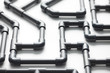 © 365mm/Stocksy - Connection of gray pipes for unity concept