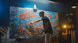 © Gorodenkoff - Talented Male Artist Energetically and Violently Using Paint Brush She Creates Modern Masterpiece of the Oil Painting. Dark and Messy Creative Studio with Large Canvas of Striking Colors
