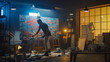 © Gorodenkoff - Talented Male Artist Energetically and Violently Using Paint Brush he Creates Modern Masterpiece of the Oil Painting. Dark and Messy Creative Studio with Large Canvas of Striking Colors