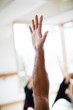 © Rob and Julia Campbell/Stocksy - Sweaty yoga hand and arm