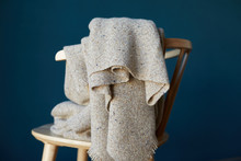 Seat And Blanket With Blue Wall Background
