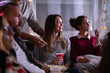© Jovo Jovanovic/Stocksy - Movies night - group of friends watching a movie together at home