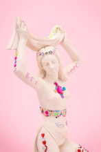 White Statue Of A Woman Decorated With Shiny Stickers.