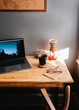 © Joe St.Pierre Photography/Stocksy - Laptop with coffee cup on desk at home