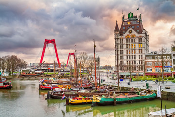 City landscape at sunset - view of the Oude Haven (or Old Port) with building the Witte Huis (or White House), the city Rotterdam in the South Holland, The Netherlands