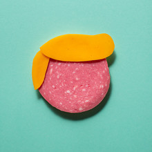 Illustration Representing A Face Made With Cheese And Salami