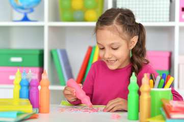 Poster - Portrait of cute smiling beautiful girl drawing at home