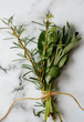 © Helen Rushbrook/Stocksy - Fresh rosemary and sage ready to flavour a stew.
