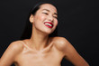 © leandro crespi/Stocksy - Asian woman smiling beauty portrait horizontal