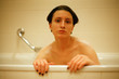 © Alexey Klementiev/Stocksy - Young Androgyne woman in bath