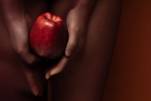 Hands Of A Woman Holding Apple