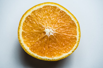 Wall Mural - Sliced orange in half on a white background