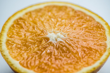 Wall Mural - Sliced orange in half on a white background