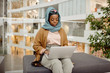 © Clique Images/Stocksy - African Muslim Woman Working in Business Center