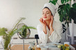 © lordn - Portrait of young woman wearing bathrobe at home. Homemade natural cosmetics skin care routine.
