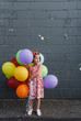 © Melanie DeFazio Photography/Stocksy - Birthday balloons