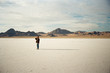 © Jesse Morrow/Stocksy - young male stands in desert with long shadow