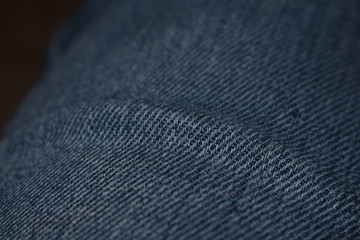 Closeup view of denim jeans, copy space.