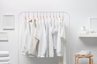 © 365mm/Stocksy - Cloakroom interior with clothes in white color