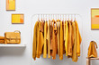 © 365mm/Stocksy - Stylish wardrobe with bright clothing on rack