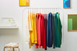 © 365mm/Stocksy - Row of vivid clothing on rack