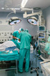 © MyMicrostock/Stocksy - Surgeons in the operating room