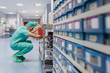 © MyMicrostock/Stocksy - Surgeon looking for paper in the hospital office