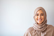 Modern, Stylish and Happy Muslim Woman Wearing a Headscarf. Arab saudi emirates woman covered with beige scarf. 
