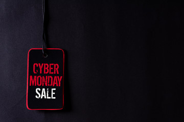 Wall Mural - Cyber Monday Sale text on a red and black tag. Shopping concept.