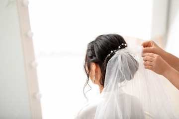 Poster - Professional hairdresser working with young Asian bride at home