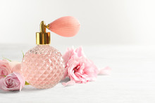 Vintage Bottle Of Perfume And Flowers On Light Background, Space For Text