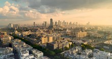 Tel Aviv Skyline From Drone. Aerial Shot Long Super Wide Horizon View. DayTime Sunset Or Early Morning Color Sky Coastline And Office Building In A Modern Tel Aviv